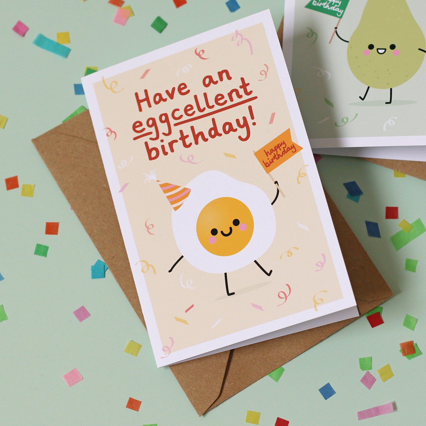 Birthday card with a kawaii style egg character and text 'Have an eggcellent birthday!' on a yellow background.