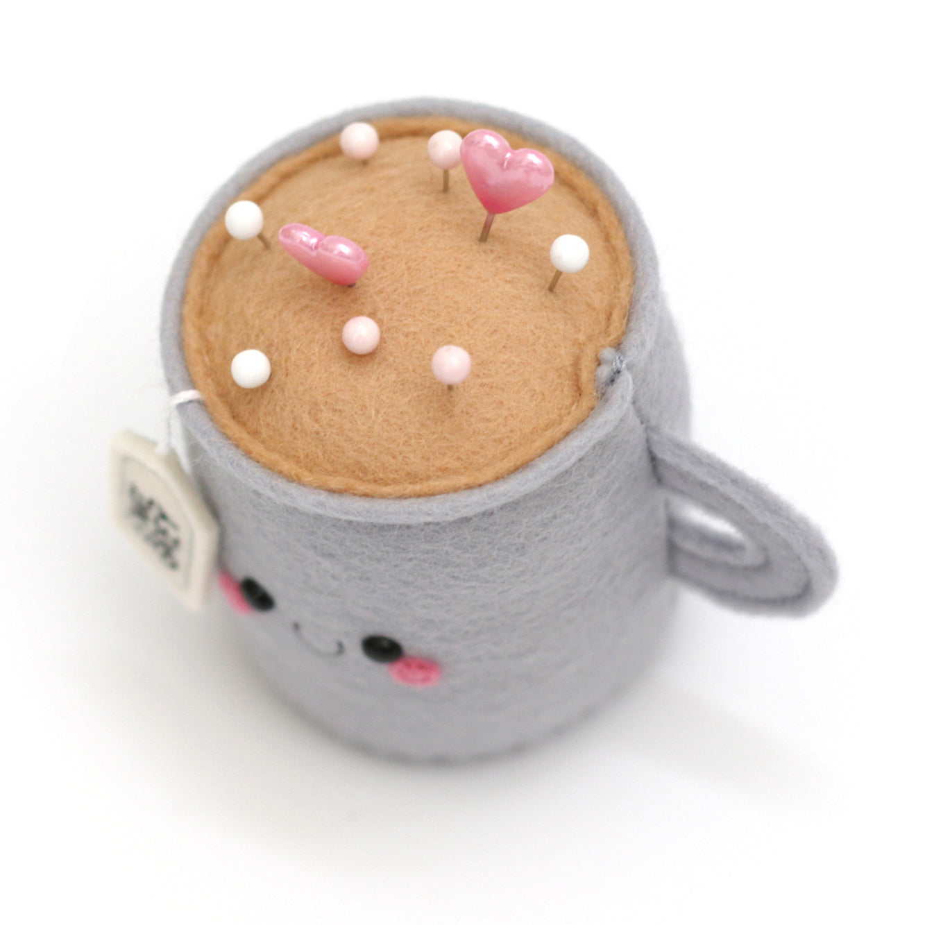 Kawaii Earl Grey Teacup Pincushion by hannahdoodle top view with sewing pins