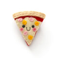 A felt pin shaped like a slice of pizza with a smiling face, featuring beige crust, ham and pineapple toppings.