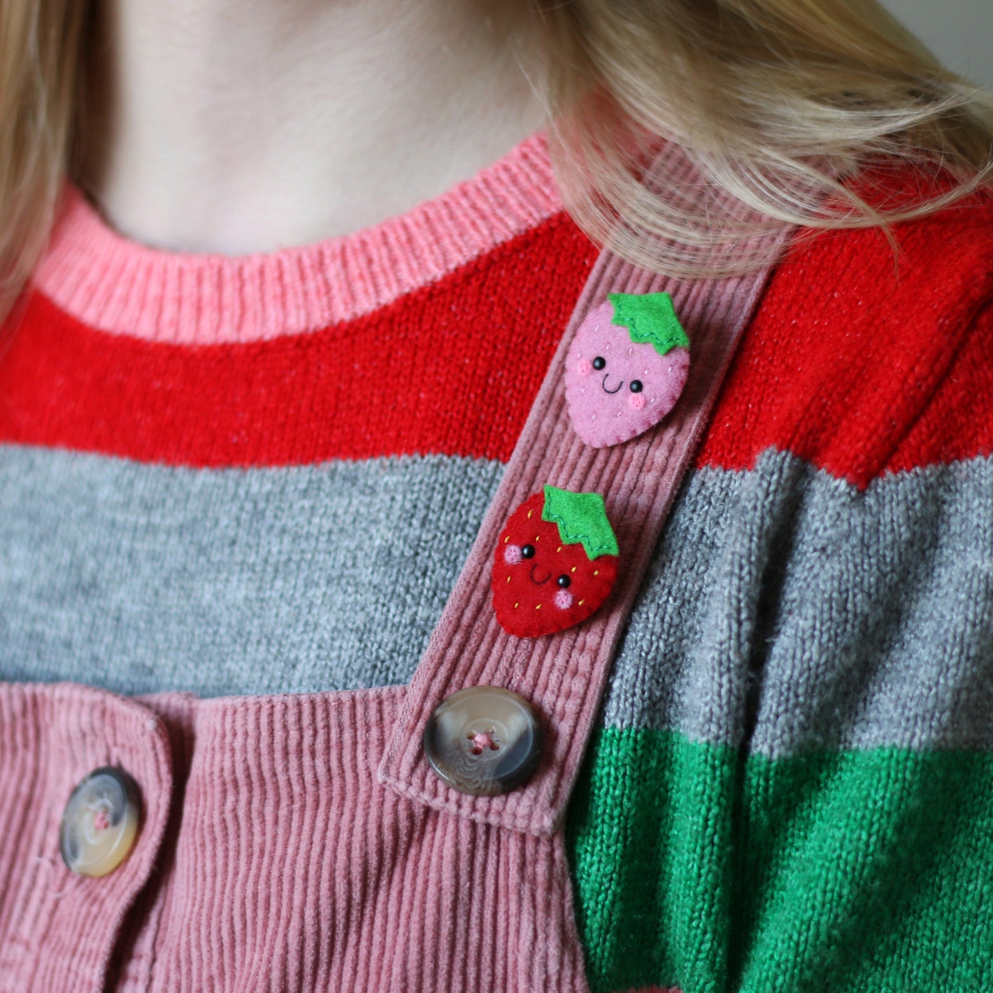 Kawaii Felt Strawberry Brooches modelled on a salmon colour dungaree dress