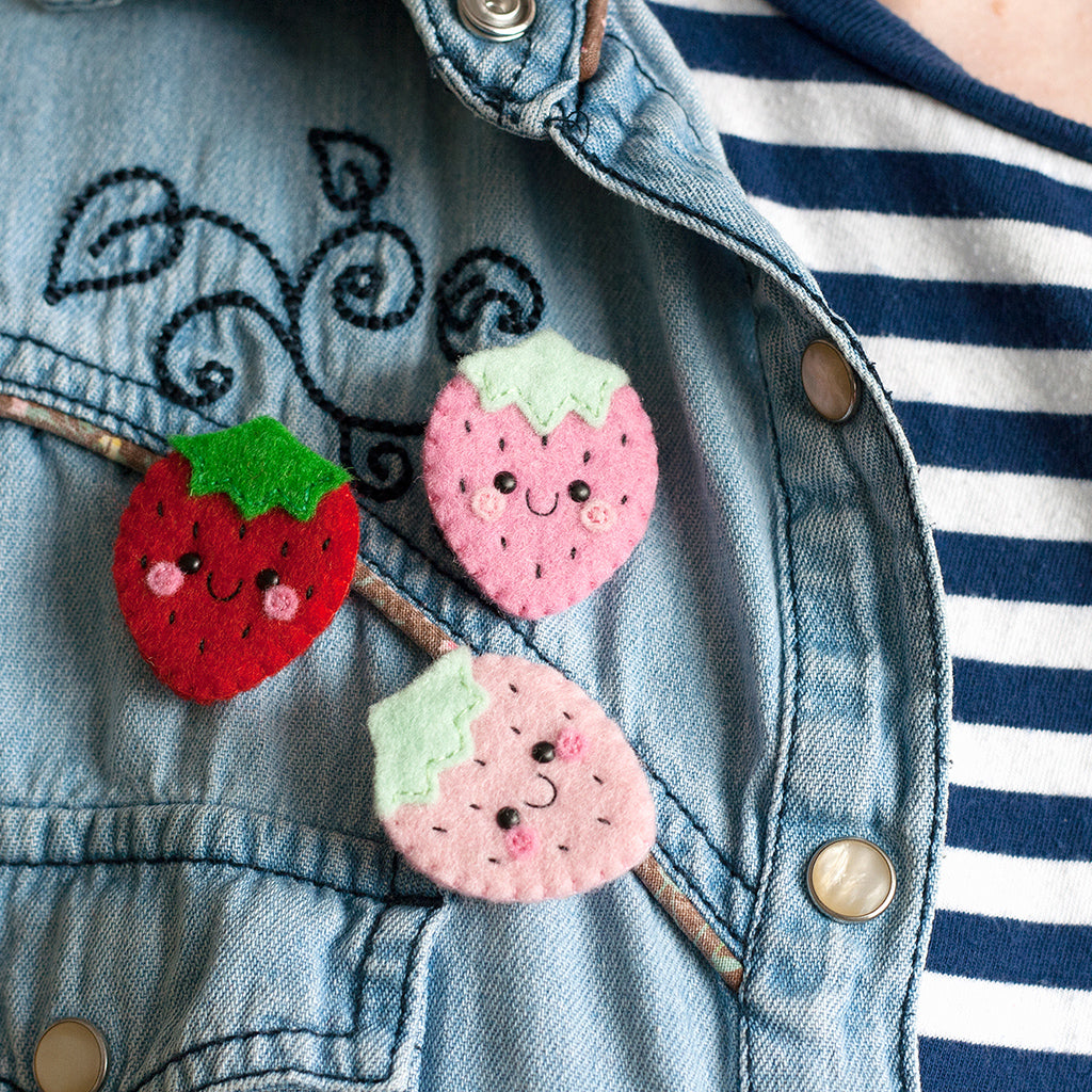 Strawberry felt brooches by hannahdoodle