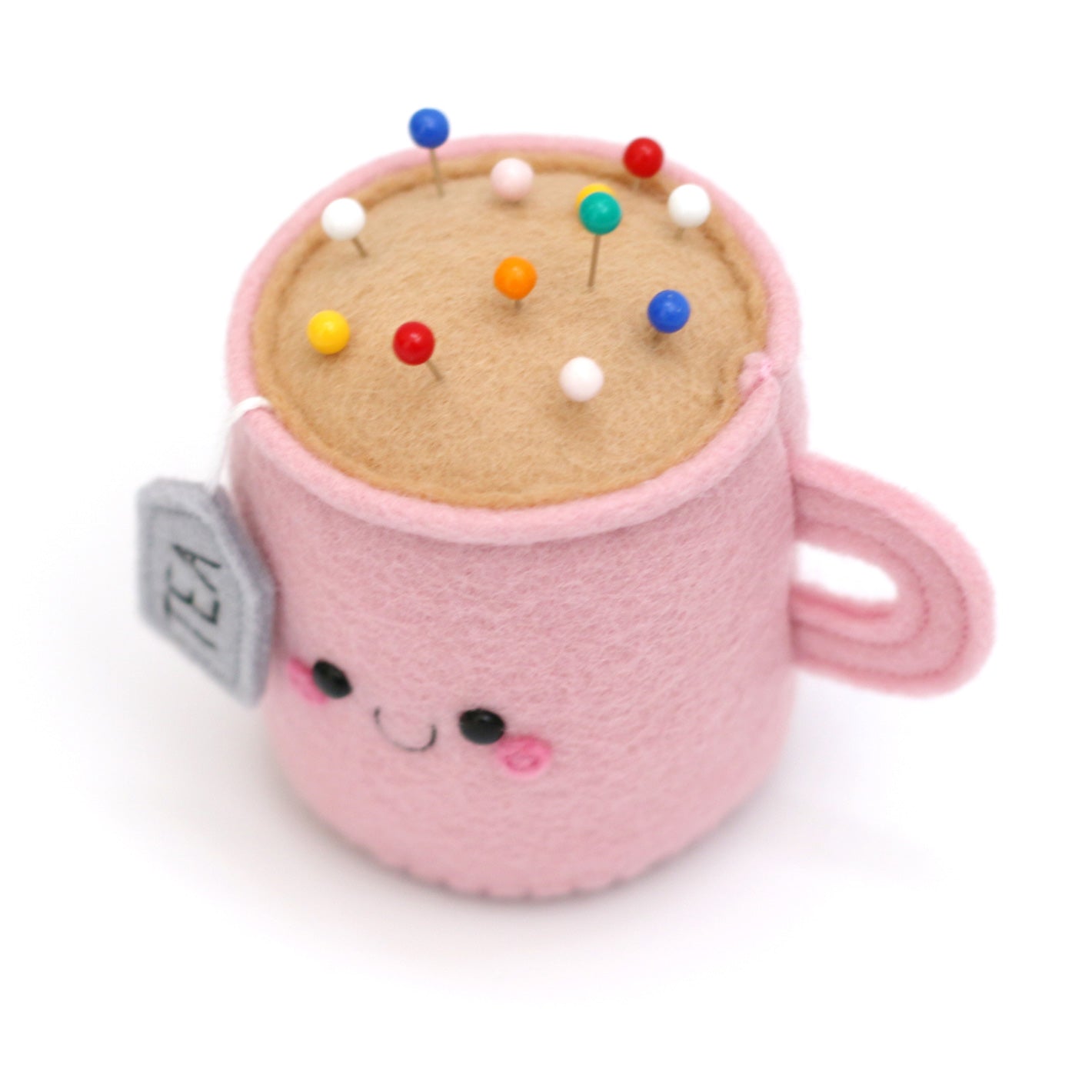 Pink Teacup Pincushion with happy face and sewing pins
