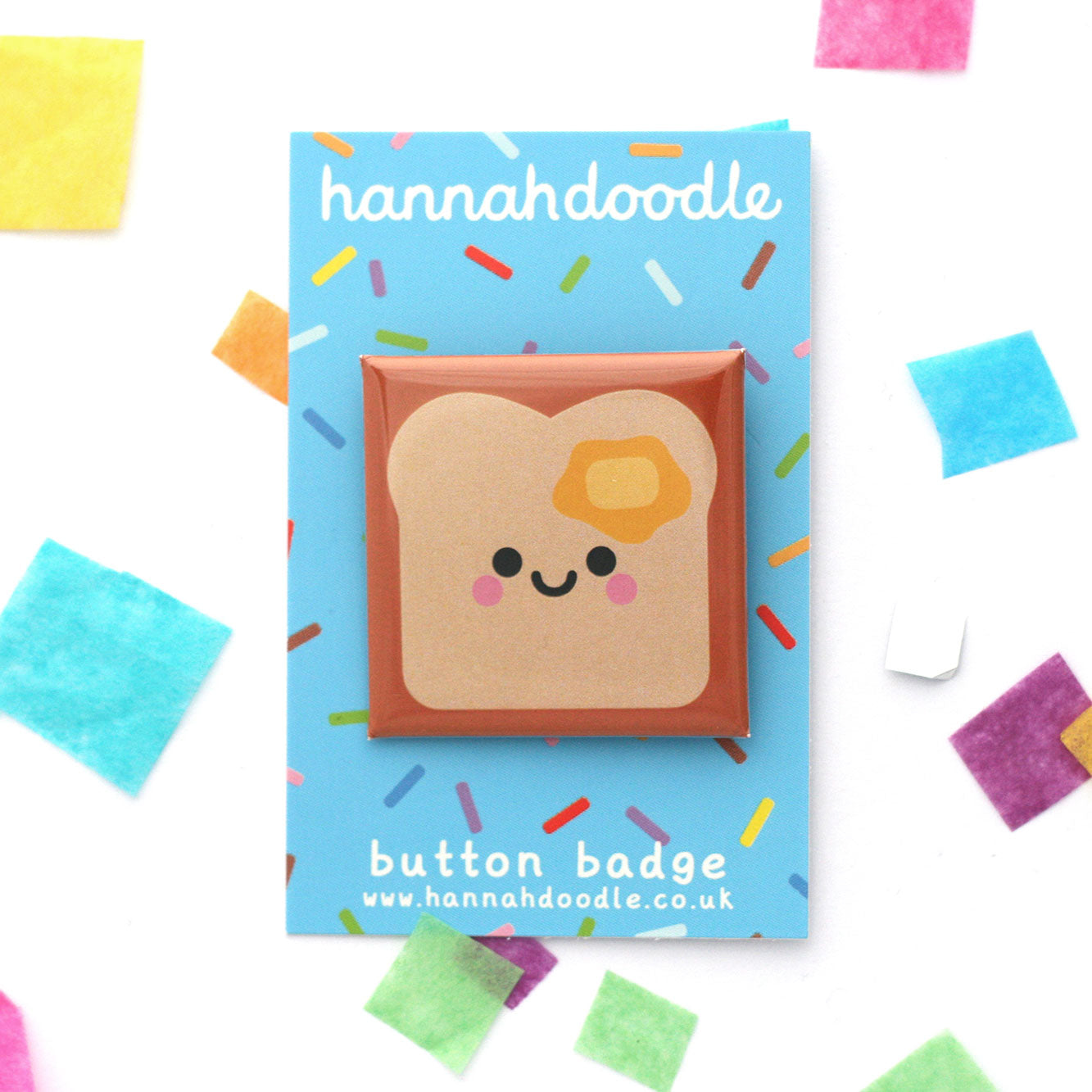 Buttered toast 38mm square button badge attached to blue hannahdoodle backing card
