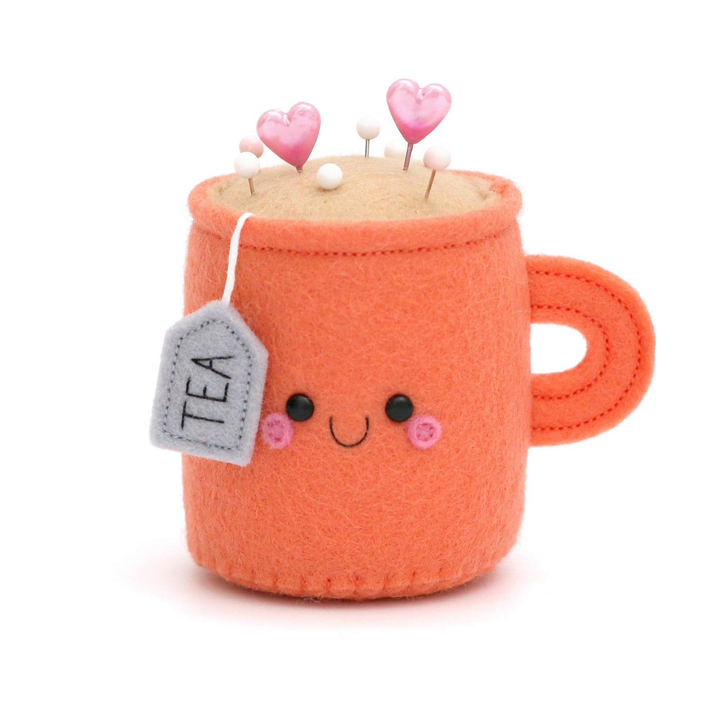 Teacup shaped pincushion in a kawaii style by hannahdoodle