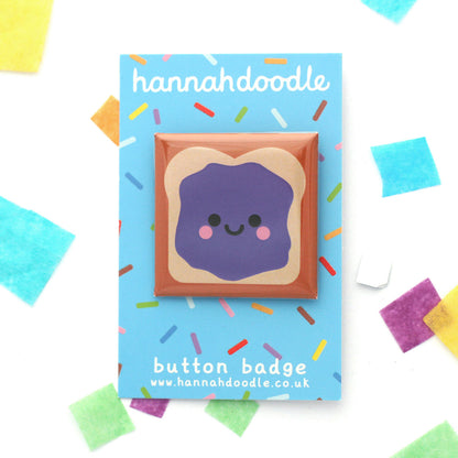 Cute jelly sandwich badge on a blue hannahdoodle branded backing card