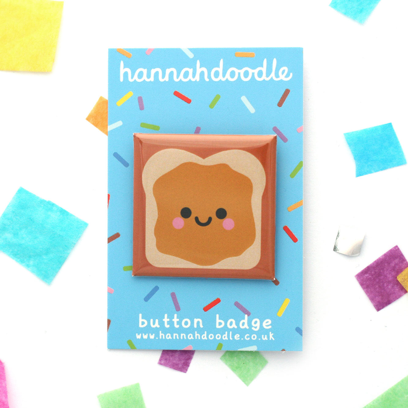 Peanut butter sandwich with smiley face square badge on blue backing card