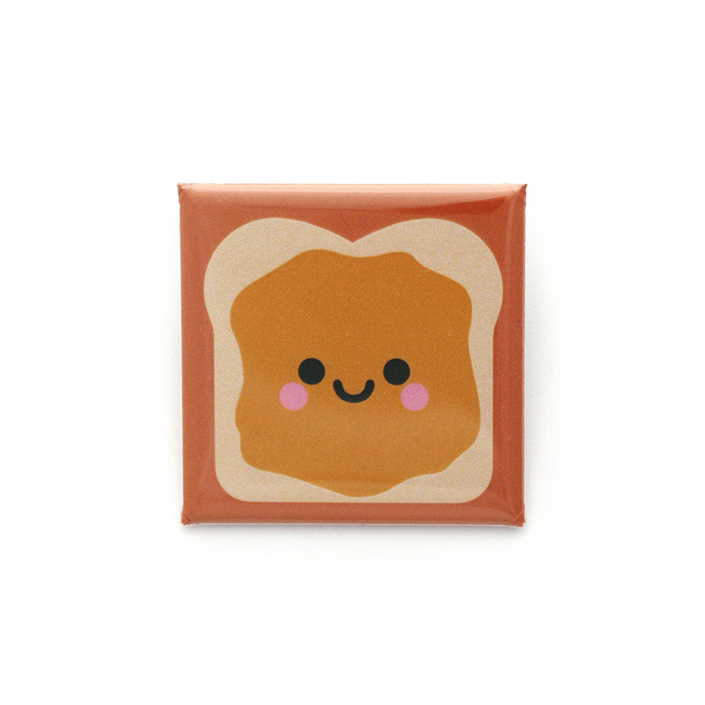 Peanut butter sandwich with smiley face square badge