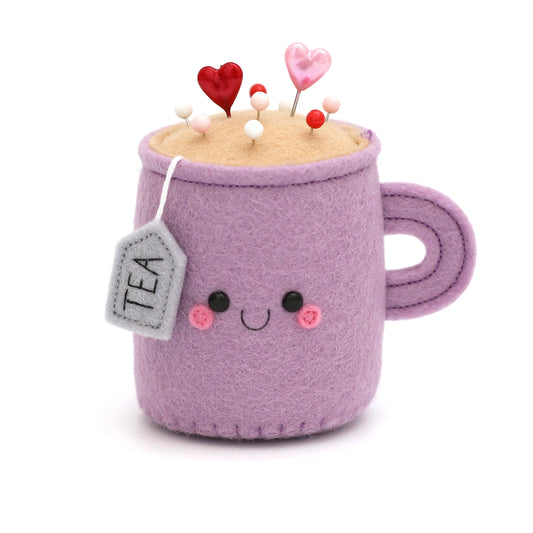 Purple Teacup Pincushion with happy face by hannahdoodle